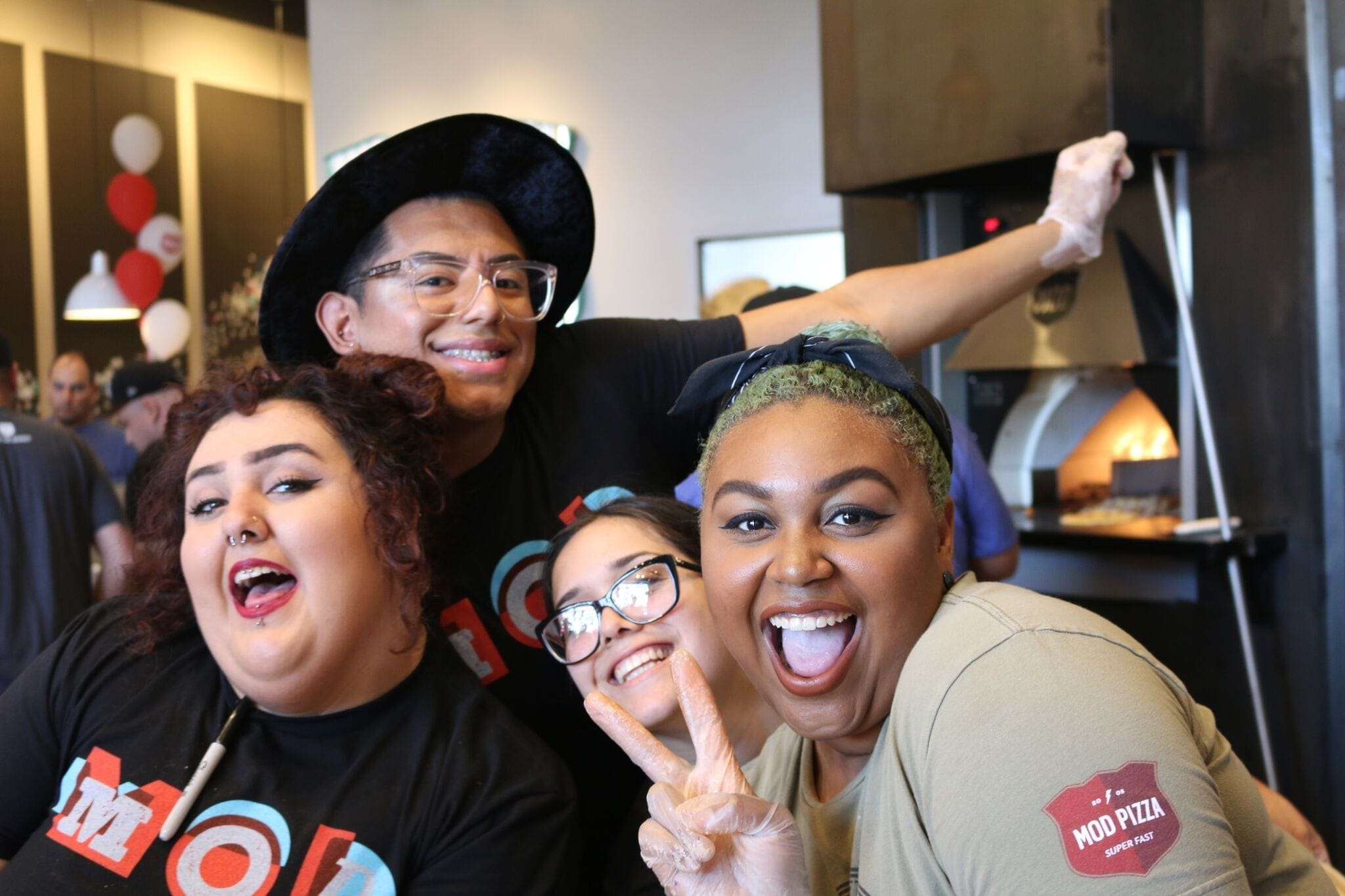 MOD Pizza employees smiling during a Talent Rewire event